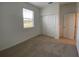 This bedroom has a window with blinds and a closet with sliding doors at 2668 Spider Lily Ct, Clermont, FL 34711