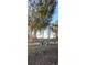 Landscaped backyard with a retaining wall, offering a peaceful retreat amidst lush greenery and natural beauty at 272 Loma Bonita Dr, Davenport, FL 33837
