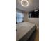 Bedroom featuring ceiling fan, mounted television and light-colored flooring at 272 Loma Bonita Dr, Davenport, FL 33837