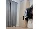 Bedroom featuring clothes rack, storage unit and gray curtains at 272 Loma Bonita Dr, Davenport, FL 33837