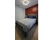 Bedroom featuring closet with sliding doors and gray-tone laminate flooring at 272 Loma Bonita Dr, Davenport, FL 33837