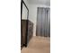 Bedroom with wood-look flooring, gray curtains, and a wooden dresser with a mirror at 272 Loma Bonita Dr, Davenport, FL 33837