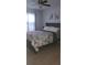 Comfortable bedroom with ceiling fan and light-colored laminate flooring at 272 Loma Bonita Dr, Davenport, FL 33837