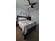 Bedroom featuring ceiling fan, closet with sliding doors and light-colored laminate flooring at 272 Loma Bonita Dr, Davenport, FL 33837