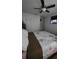 Bedroom featuring ceiling fan, mounted television and closet with sliding doors at 272 Loma Bonita Dr, Davenport, FL 33837