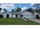 Charming single Gathering home featuring a well-maintained lawn and attached two-car garage at 272 Loma Bonita Dr, Davenport, FL 33837