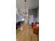 Open living area with hardwood floors and a view into the living room and office space at 272 Loma Bonita Dr, Davenport, FL 33837