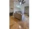 A modern living room featuring travertine floors, neutral decor, and vaulted ceilings at 272 Loma Bonita Dr, Davenport, FL 33837