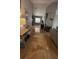 The living room features travertine floors, a large decorative mirror, and a view into other living areas at 272 Loma Bonita Dr, Davenport, FL 33837