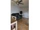 Living room with tile flooring, ceiling fan, and comfortable seating at 272 Loma Bonita Dr, Davenport, FL 33837