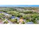 An aerial view showcases this community home nestled amongst the beautiful trees at 2932 Bayhead Run, Oviedo, FL 32765