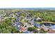 An aerial view of the neighborhood showcasing the community lake and lush landscaping at 2932 Bayhead Run, Oviedo, FL 32765