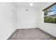 Bright carpeted bedroom features a closet and a window with green views, creating a welcoming atmosphere at 2932 Bayhead Run, Oviedo, FL 32765