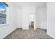 Carpeted bedroom with a bathroom doorway, window with green views, and a closet, offering a complete suite at 2932 Bayhead Run, Oviedo, FL 32765