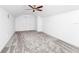 An empty bedroom with gray carpet, white walls, and a ceiling fan at 2932 Bayhead Run, Oviedo, FL 32765