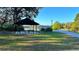 Picturesque lakeside community gazebo with seating, perfect for relaxing and enjoying the scenic views at 2932 Bayhead Run, Oviedo, FL 32765