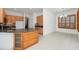 Kitchen island featuring granite countertop, cabinets, and stainless steel sink at 2932 Bayhead Run, Oviedo, FL 32765