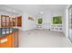 Living room featuring built-in shelving and cabinetry, plus tiled floors at 2932 Bayhead Run, Oviedo, FL 32765