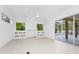 The bright living room has tile floors, recessed lights, and large windows at 2932 Bayhead Run, Oviedo, FL 32765