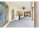 Covered patio features a ceiling fan, wet bar, and access to the pool at 2932 Bayhead Run, Oviedo, FL 32765
