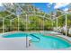 Inviting screened-in pool area with a relaxing spa and a lush, private backyard at 2932 Bayhead Run, Oviedo, FL 32765