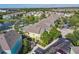 Beautiful aerial view of vibrant townhomes nestled in a lush, tropical community with mature trees at 3002 Bonfire Beach Dr # 202, Kissimmee, FL 34746
