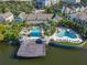A scenic aerial view showcasing the community pools, pier, surrounding landscape and residential buildings at 3002 Bonfire Beach Dr # 202, Kissimmee, FL 34746