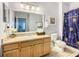 Full bathroom with a vanity, toilet, and a shower with a patterned curtain at 3002 Bonfire Beach Dr # 202, Kissimmee, FL 34746