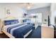 Bright bedroom featuring a bunk bed, queen bed, ceiling fan and flat-screen TV at 3002 Bonfire Beach Dr # 202, Kissimmee, FL 34746