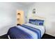 Cozy bedroom featuring a walk-in closet and relaxing decor at 3002 Bonfire Beach Dr # 202, Kissimmee, FL 34746