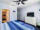 Comfortable bedroom with an ensuite and closet access, plus a flat-screen TV at 3002 Bonfire Beach Dr # 202, Kissimmee, FL 34746