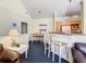 Open dining area with seating for four adjoins the breakfast bar and kitchen at 3002 Bonfire Beach Dr # 202, Kissimmee, FL 34746
