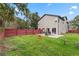 Expansive backyard features a well-maintained lawn, a privacy fence, and a patio area perfect for outdoor entertaining at 3007 E Central Blvd # 3007, Orlando, FL 32803