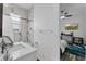Modern bathroom showcasing marble wall tiles, vanity and shower with natural light at 3007 E Central Blvd # 3007, Orlando, FL 32803