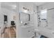 Bright bathroom with elegant vanity, a marble-walled shower/tub, and modern fixtures at 3007 E Central Blvd # 3007, Orlando, FL 32803