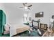 Cozy bedroom featuring a ceiling fan, a comfortable bed and an elegant accent rug at 3007 E Central Blvd # 3007, Orlando, FL 32803