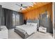 Stylish bedroom highlighting modern ceiling decor, large windows with dark curtains, and a gray bed at 3007 E Central Blvd # 3007, Orlando, FL 32803