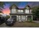 Stately home featuring arched windows, a two-car garage, and elegant landscaping at 3007 E Central Blvd # 3007, Orlando, FL 32803