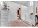 Upstairs hallway with view of the landing and nearby bedroom at 3007 E Central Blvd # 3007, Orlando, FL 32803