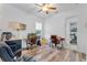 Bright home office features wood floors, two desks, and a ceiling fan at 3007 E Central Blvd # 3007, Orlando, FL 32803