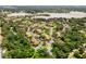 A high-angle perspective showcasing the community's location near a beautiful lake and wooded areas at 305 Lakepointe Dr # 103, Altamonte Springs, FL 32701