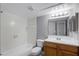 Cozy bathroom featuring a shower-tub combo, single vanity, and modern fixtures at 305 Lakepointe Dr # 103, Altamonte Springs, FL 32701