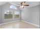 Bright bedroom with tile floors, vaulted ceiling, and large windows at 305 Lakepointe Dr # 103, Altamonte Springs, FL 32701