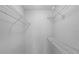Walk-in closet with multiple wire shelves and a clean interior at 305 Lakepointe Dr # 103, Altamonte Springs, FL 32701
