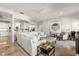 Bright living room with marble floors, comfortable seating, and an open layout flowing into the kitchen at 315 E New England Ave # 30, Winter Park, FL 32789