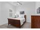 Well-lit bedroom with a ceiling fan, a large window and matching furnishings at 3186 Sailing Pier Ave, Winter Garden, FL 34787