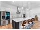 Modern kitchen with stainless steel appliances, a large island, and white cabinets at 3186 Sailing Pier Ave, Winter Garden, FL 34787