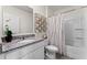 Bathroom featuring granite countertops, bright white cabinets, and a bathtub and shower combination at 3322 Wye Oak Dr, Apopka, FL 32703