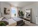 Spacious bedroom with neutral tones, large windows, an art piece and a mirror at 3322 Wye Oak Dr, Apopka, FL 32703