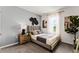 Bedroom with a gray accent wall, modern art and a comfortable bed at 3322 Wye Oak Dr, Apopka, FL 32703